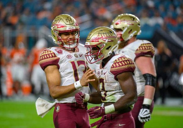 MIAMI GARDENS, FL - NOVEMBER 05: Florida State running back Trey Benson (3) celebrates scoring a touchdown with Florida State quarterback Jordan Travis (13) during the college football game between the Florida State Seminoles and the University of Miami Hurricanes on November 5, 2022 at the Hard Rock Stadium in Miami Gardens, FL. (Photo by Doug Murray/Icon Sportswire via Getty Images)