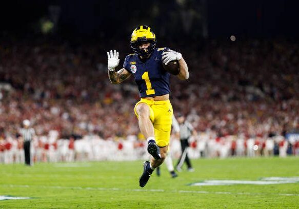 PASADENA, CALIFORNIA - JANUARY 01: Wide receiver Roman Wilson #1 of the Michigan Wolverines celebrates as he scores a touchdown during the CFP Semifinal Rose Bowl Game against the Alabama Crimson Tide at Rose Bowl Stadium on January 1, 2024 in Pasadena, California. (Photo by Ryan Kang/Getty Images)